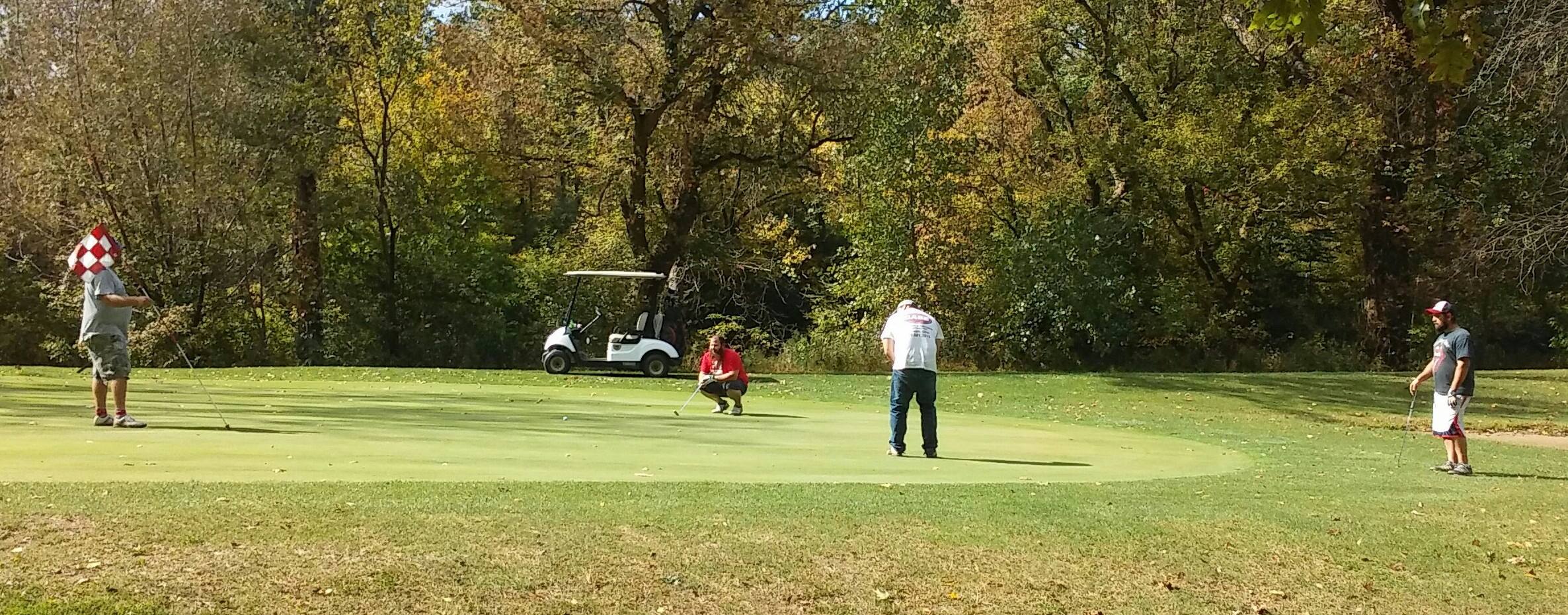 Foursome golfing